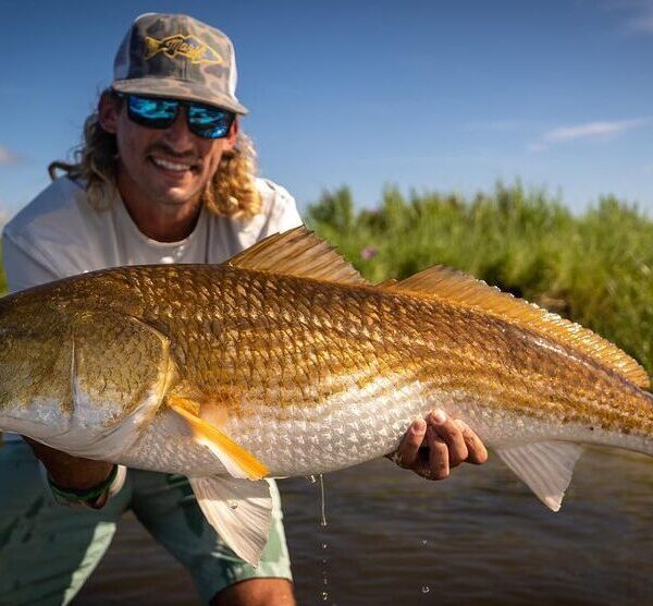 Fisherman holding Redfish