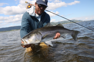 Fly Angler Holding Bass