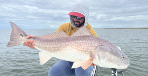 Angler with Big Redfish